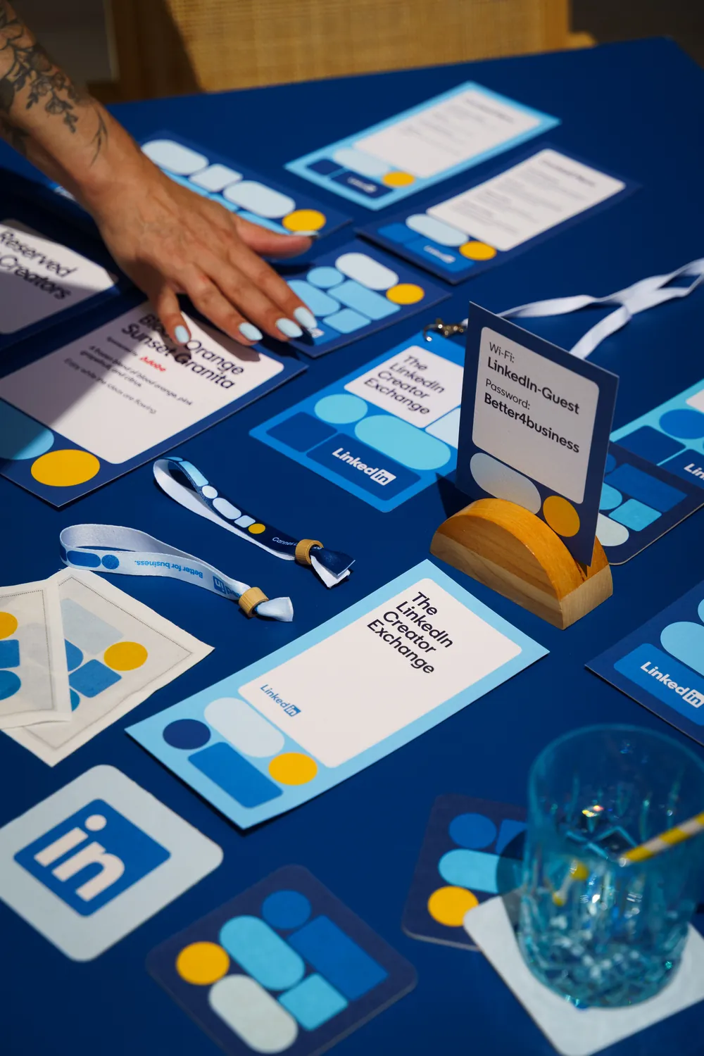 Printed programmes and cards on a blue table